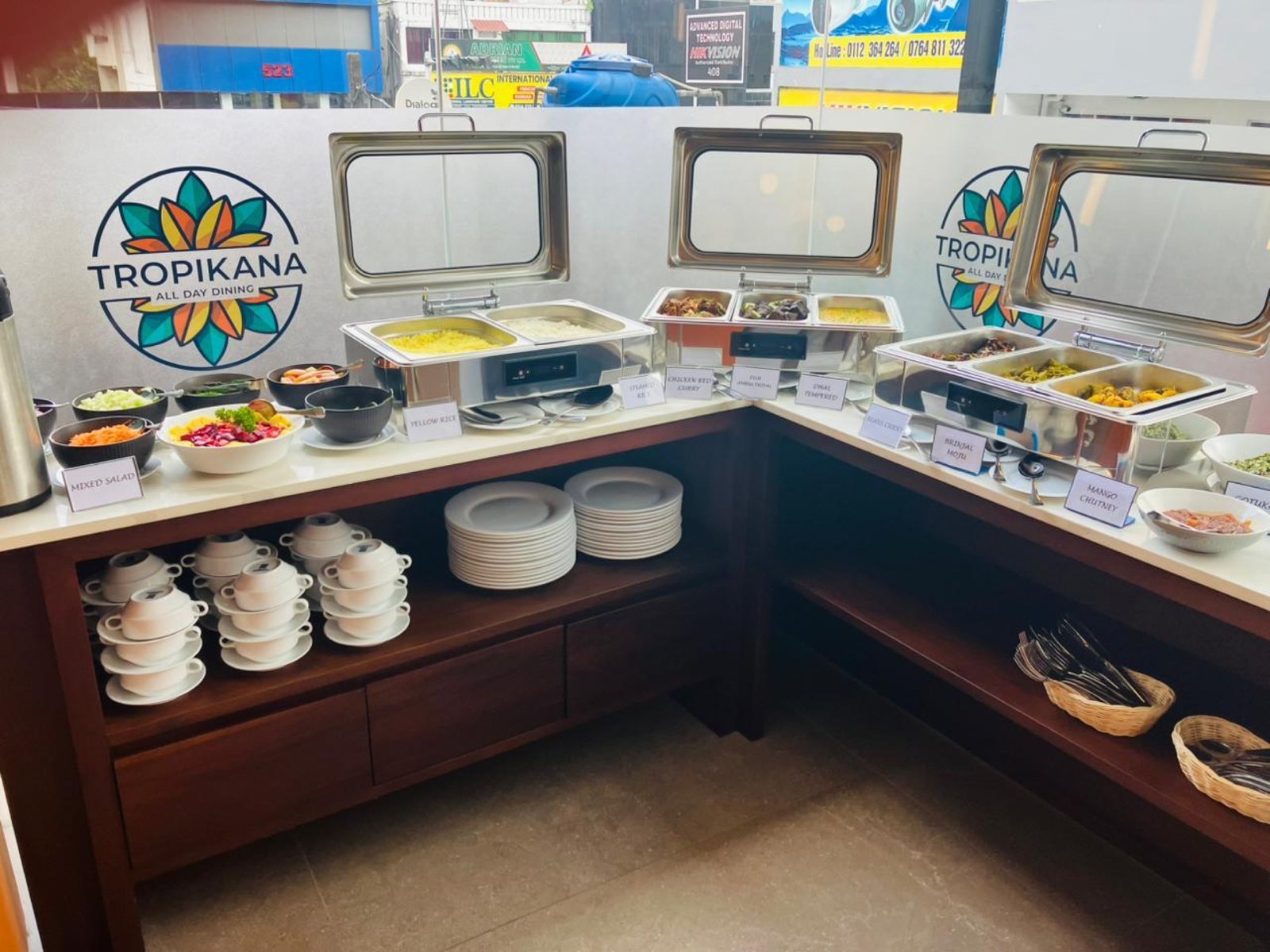 Tropikana buffet presentation with chafing dishes and table settings