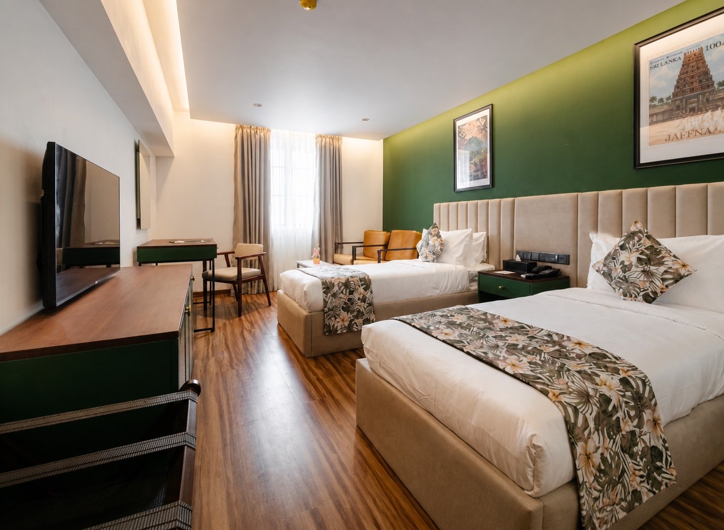 Deluxe Twin Room with two single beds and green feature wall at MK Colombo